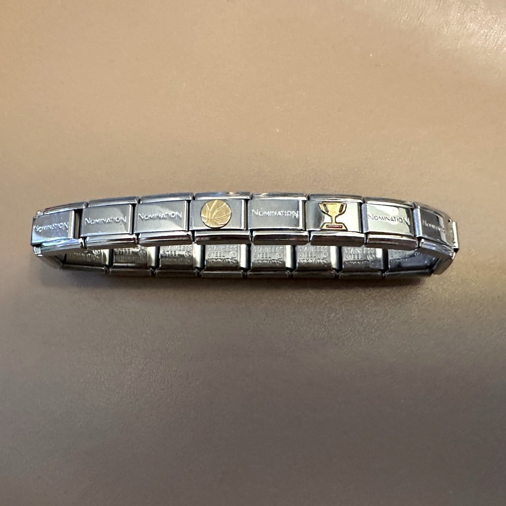 Nomination bracelet new never worn, received as gift, 2 charms basketball/trophy